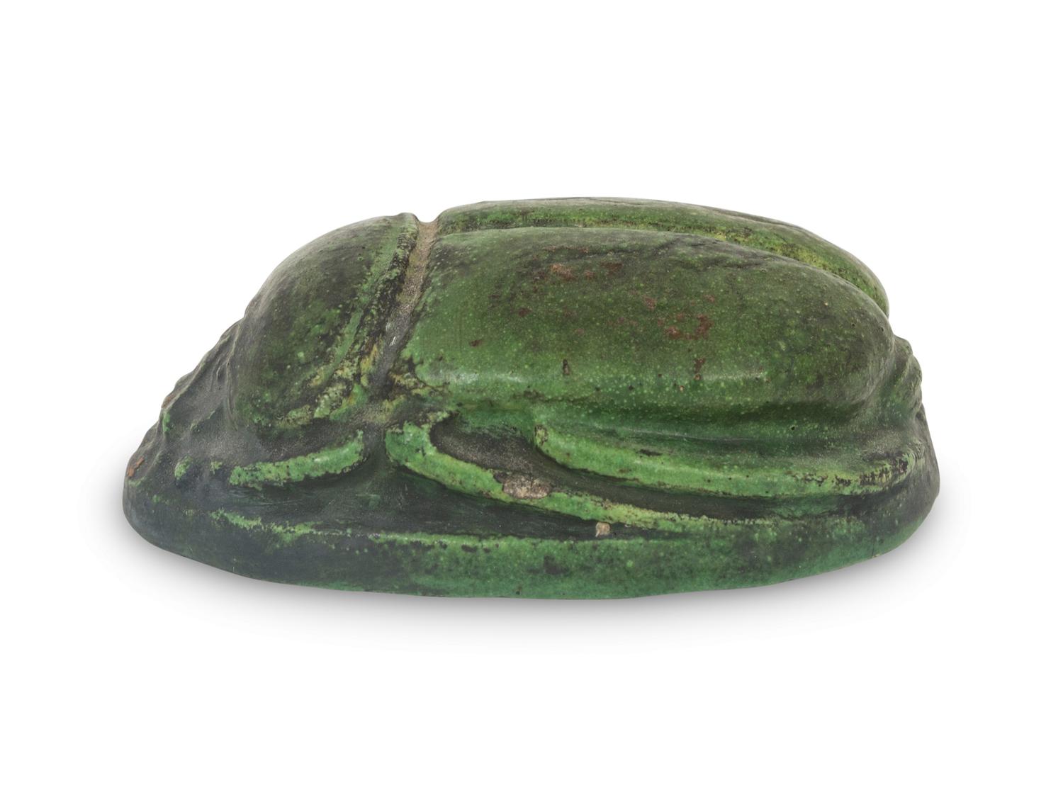 A Grueby Pottery Matte Green Scarab Paperweight