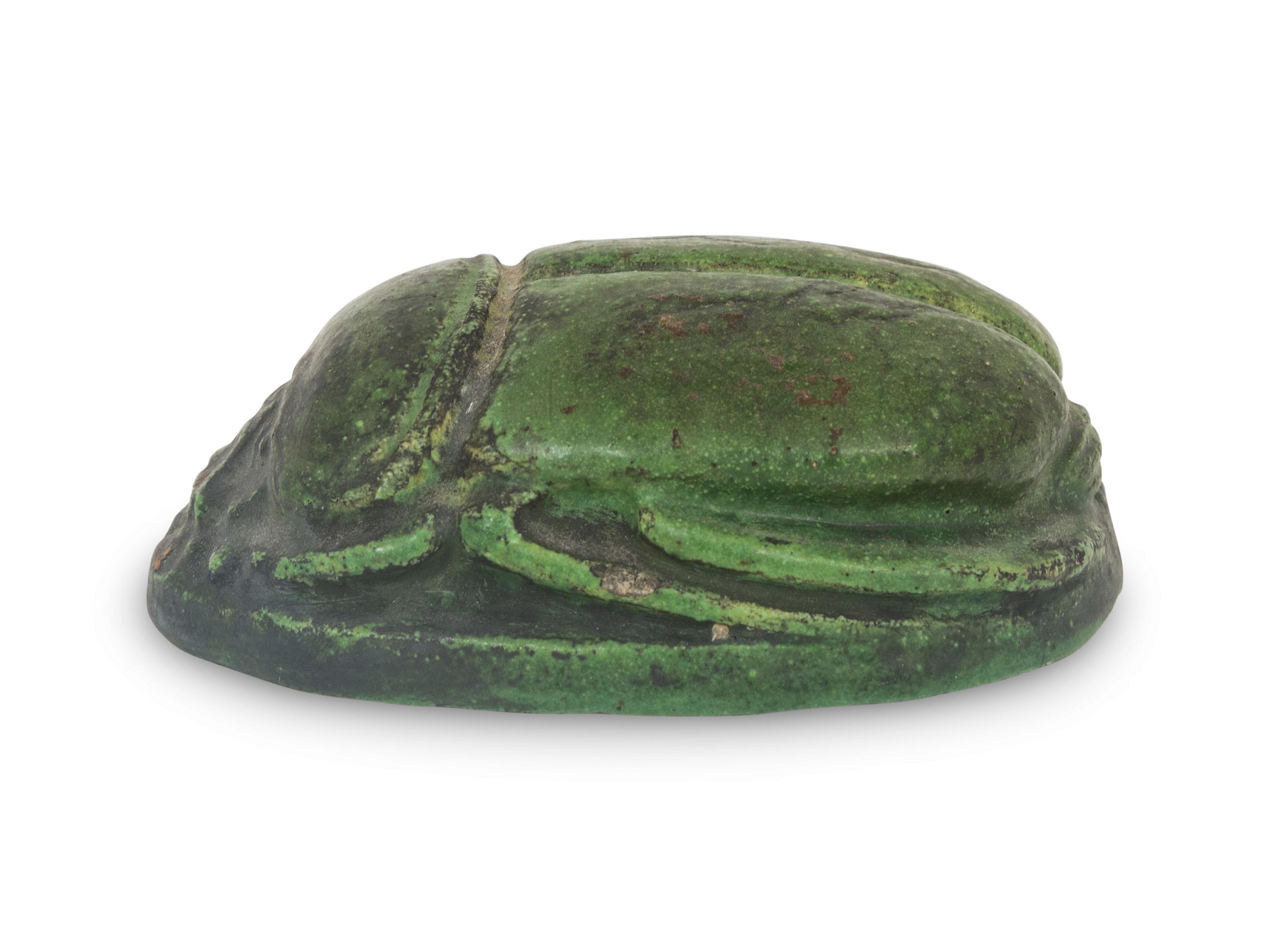 A Grueby Pottery Matte Green Scarab Paperweight