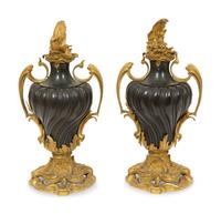 A Pair of French Gilt and Patinated Bronze Urns