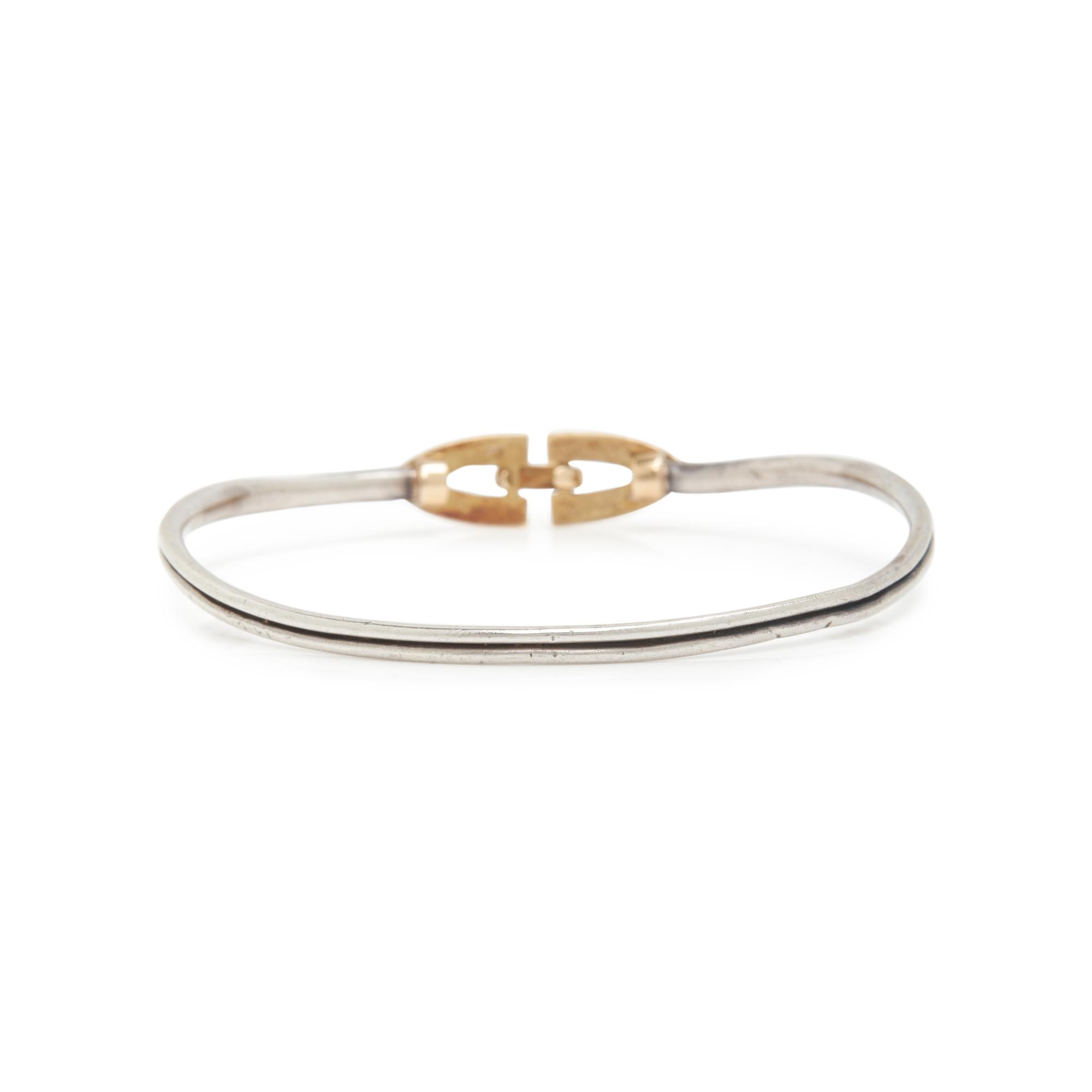 CARTIER, STERLING SILVER AND YELLOW GOLD BRACELET