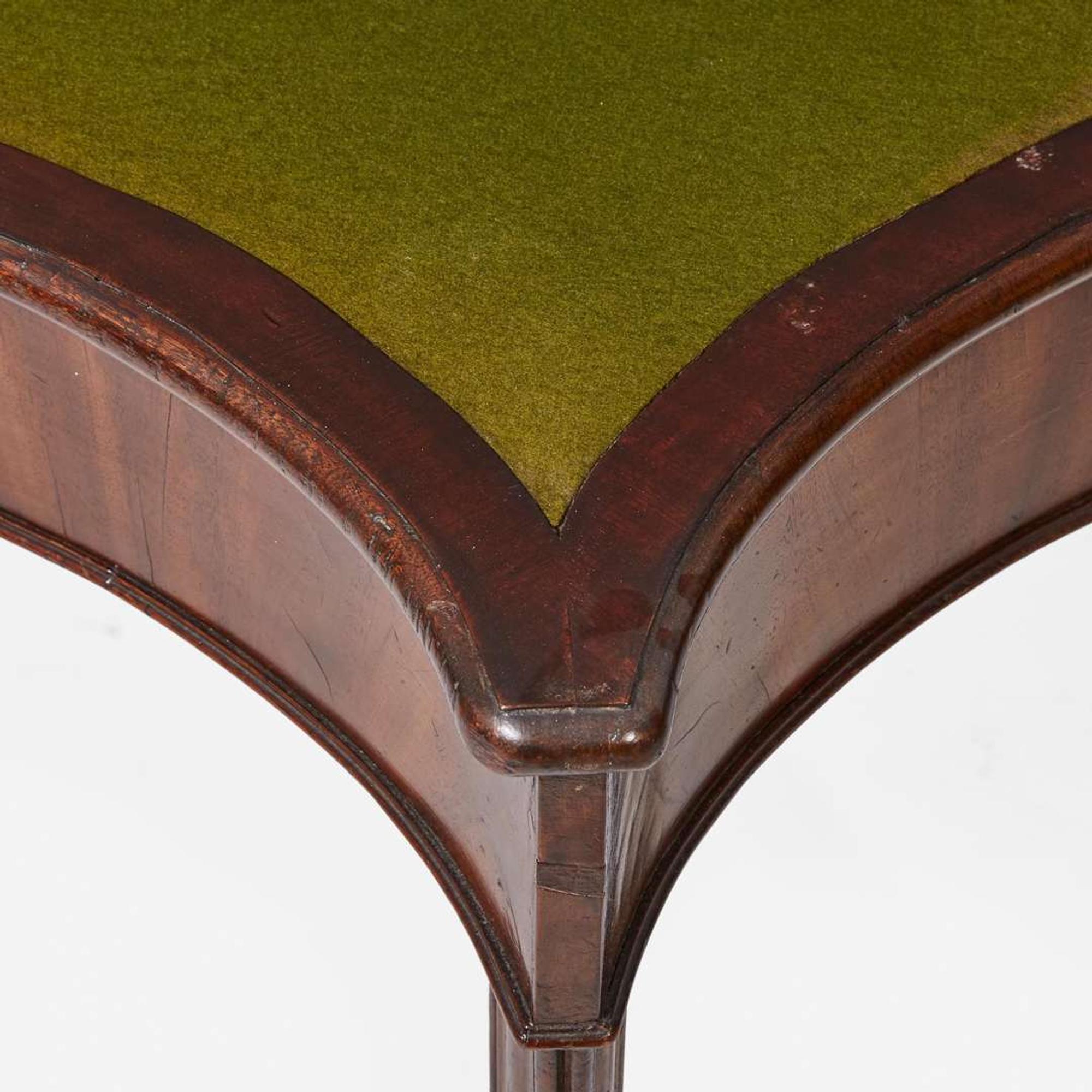 A George III serpentine carved mahogany card table circa 1770