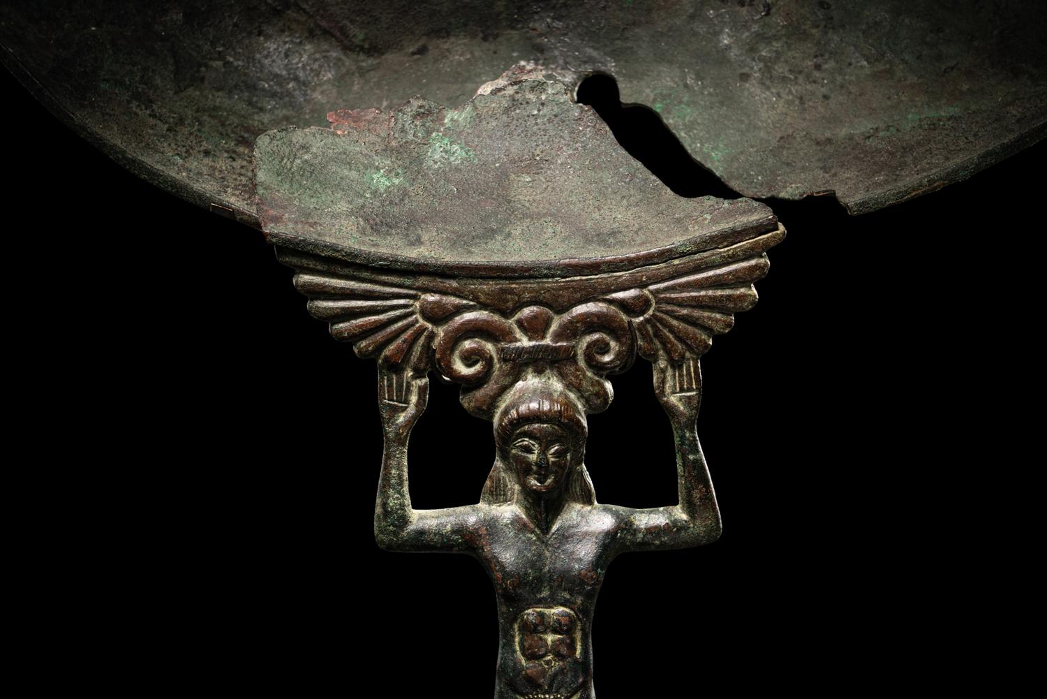 A Western Greek Bronze Patera with a Nude Youth as Handle