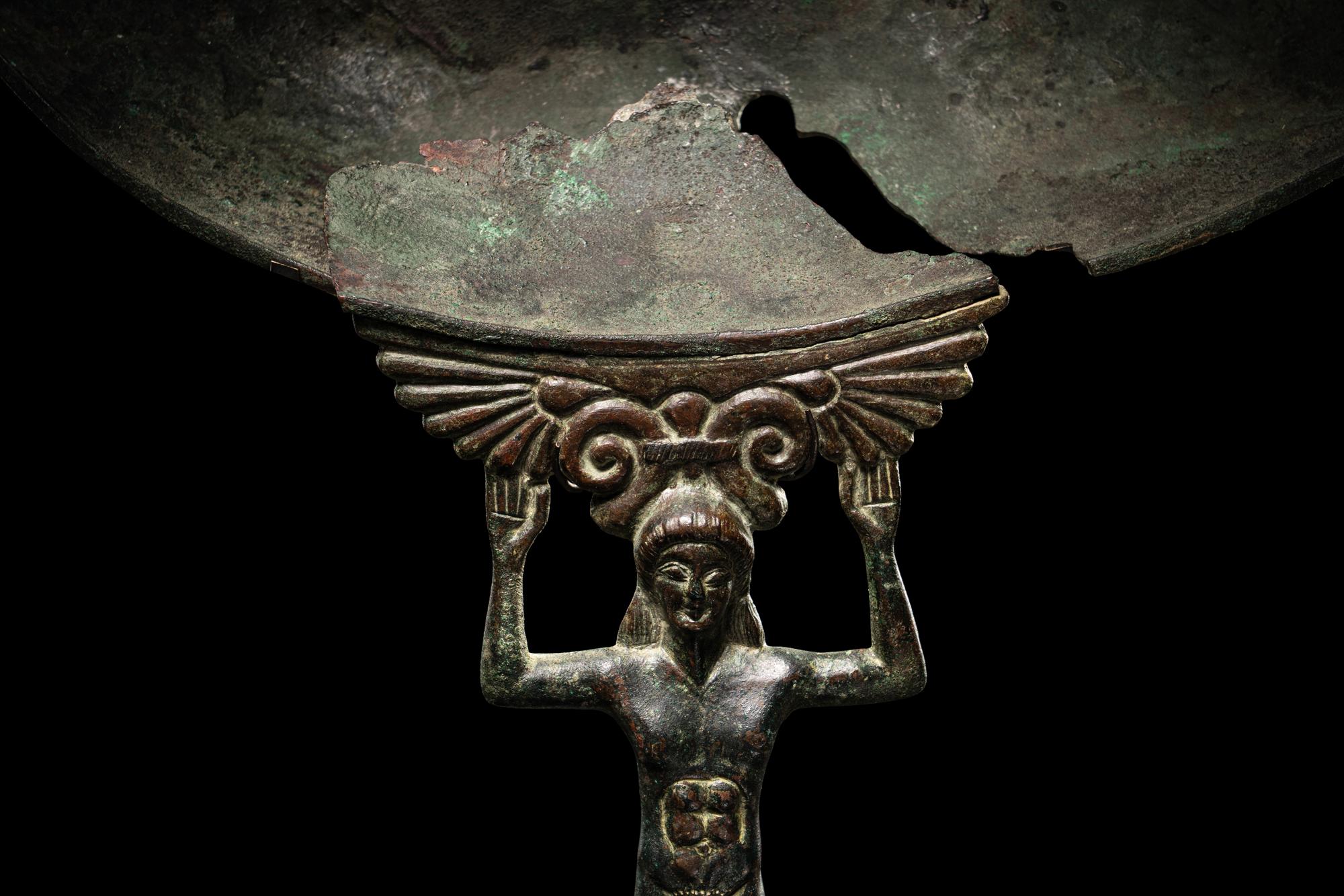 A Western Greek Bronze Patera with a Nude Youth as Handle