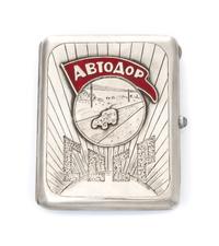 A Russian Silver and Enamel Cigarette Case, Maker's mark AO, of rectangular form, the lid centered by an applied roundel decorated with