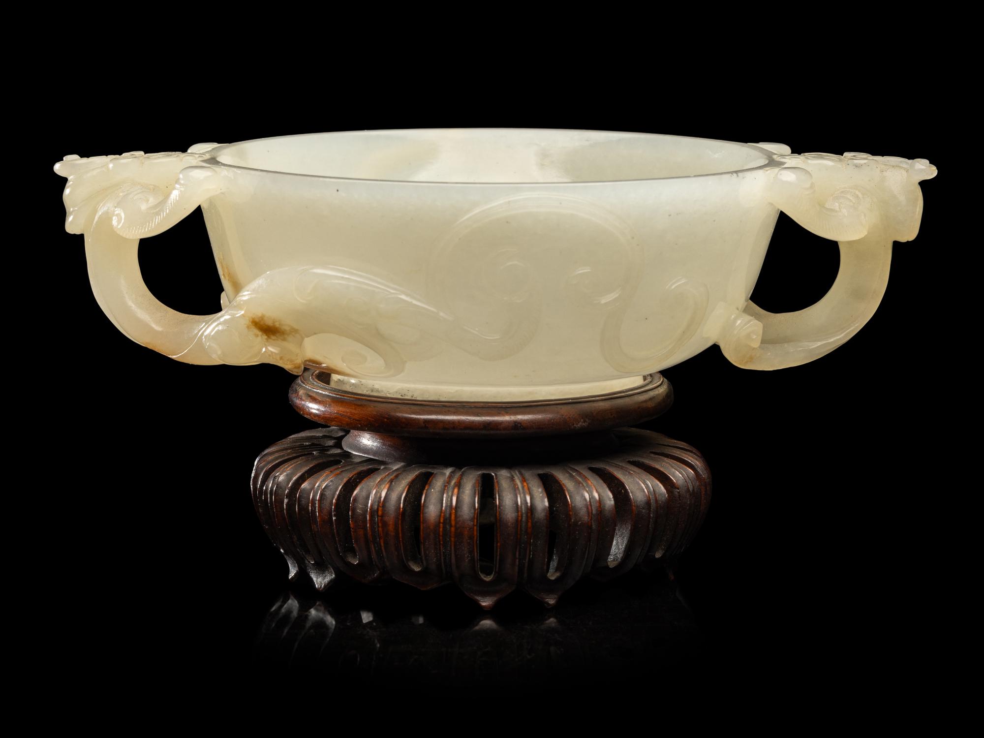 A Chinese Carved White Jade 'Chilong' Handled Cup, 19th/Early 20th Century 晚清/民國 白玉螭龍雙耳杯