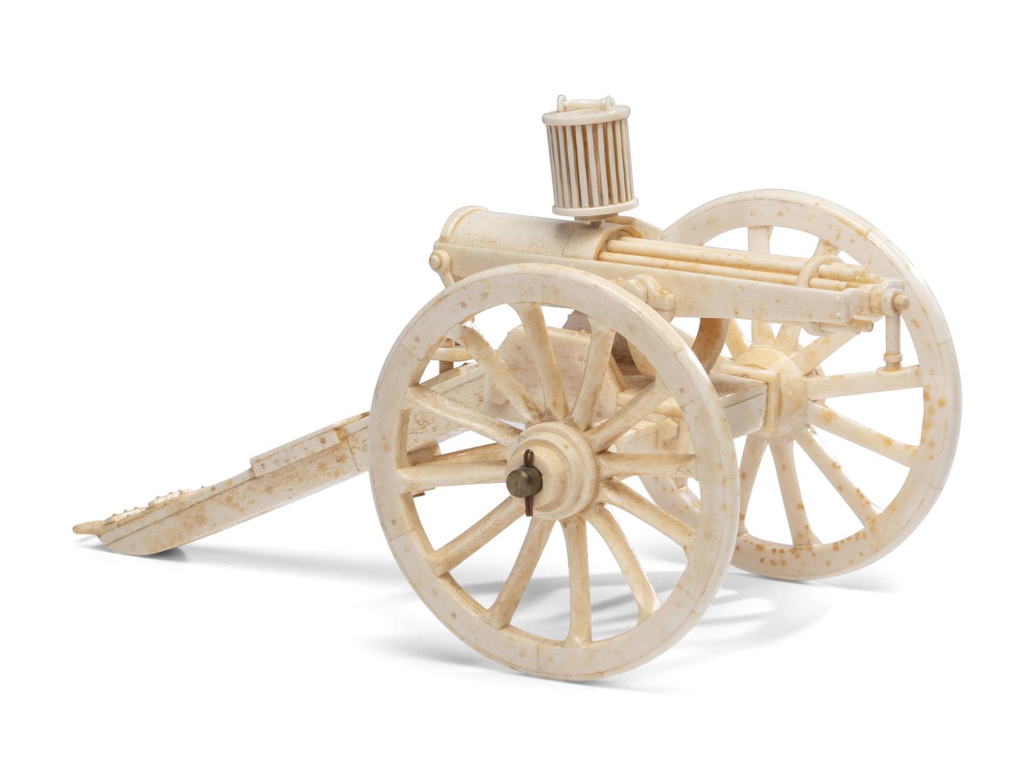 A Carved Walrus Ivory and Bone Gatling Gun Model