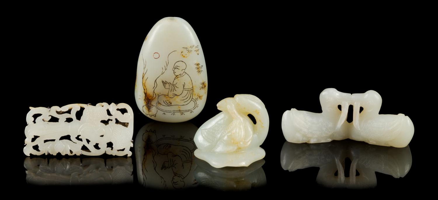 Four Jade Carvings Length of largest 2 3/4 inches.