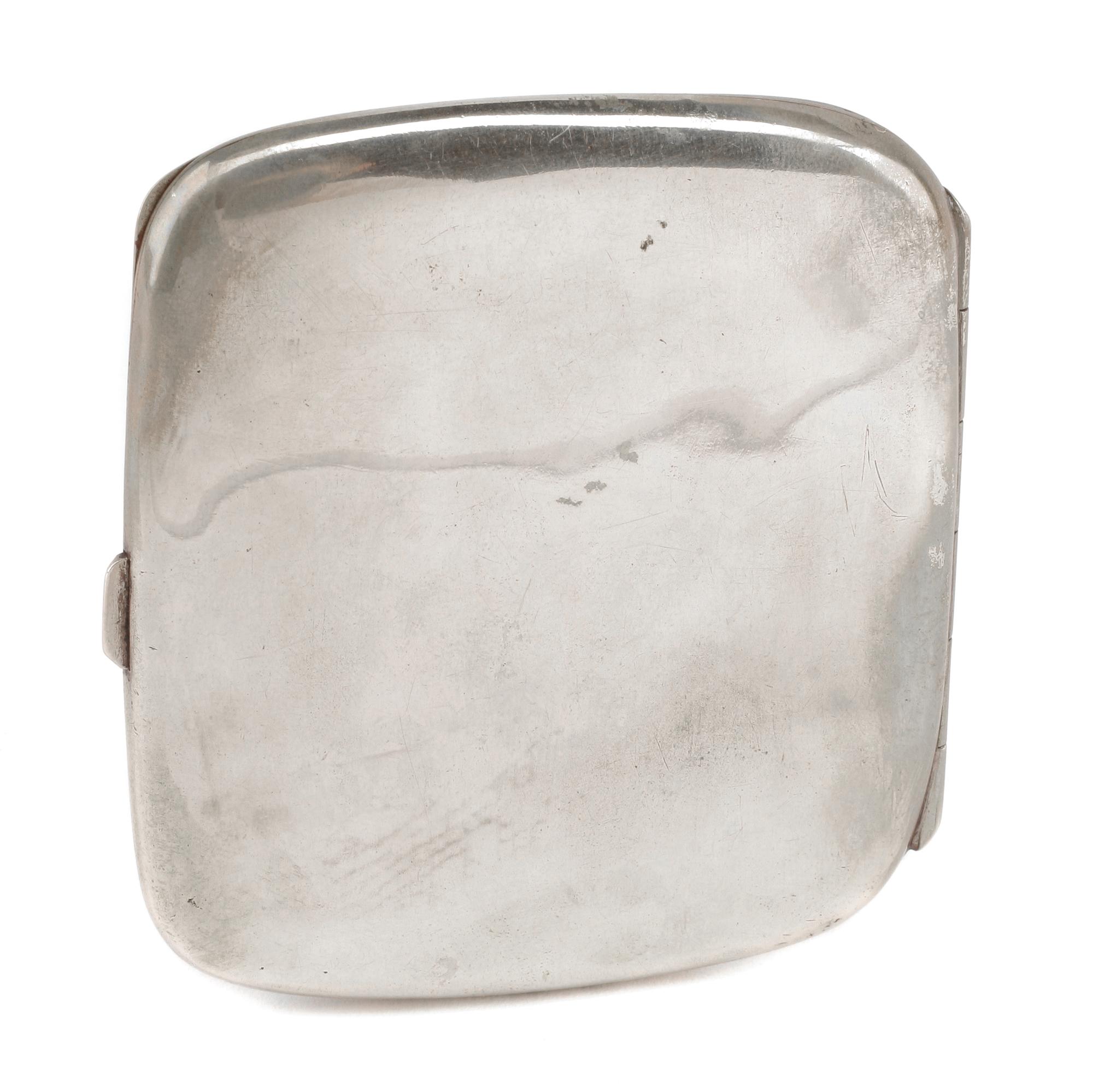 A German Enameled Silver Cigarette Case, Late 19th/Early 20th Century, the lid decorated with a female figure posing in a state of undr