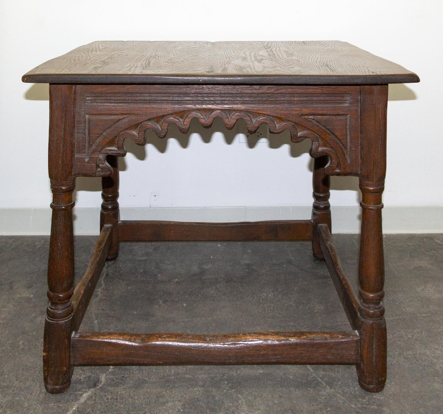 A Gothic Revival Oak Center Table Height 30 1/4 x width 36 x depth 36 inches. — EARLY 20TH CENTURY