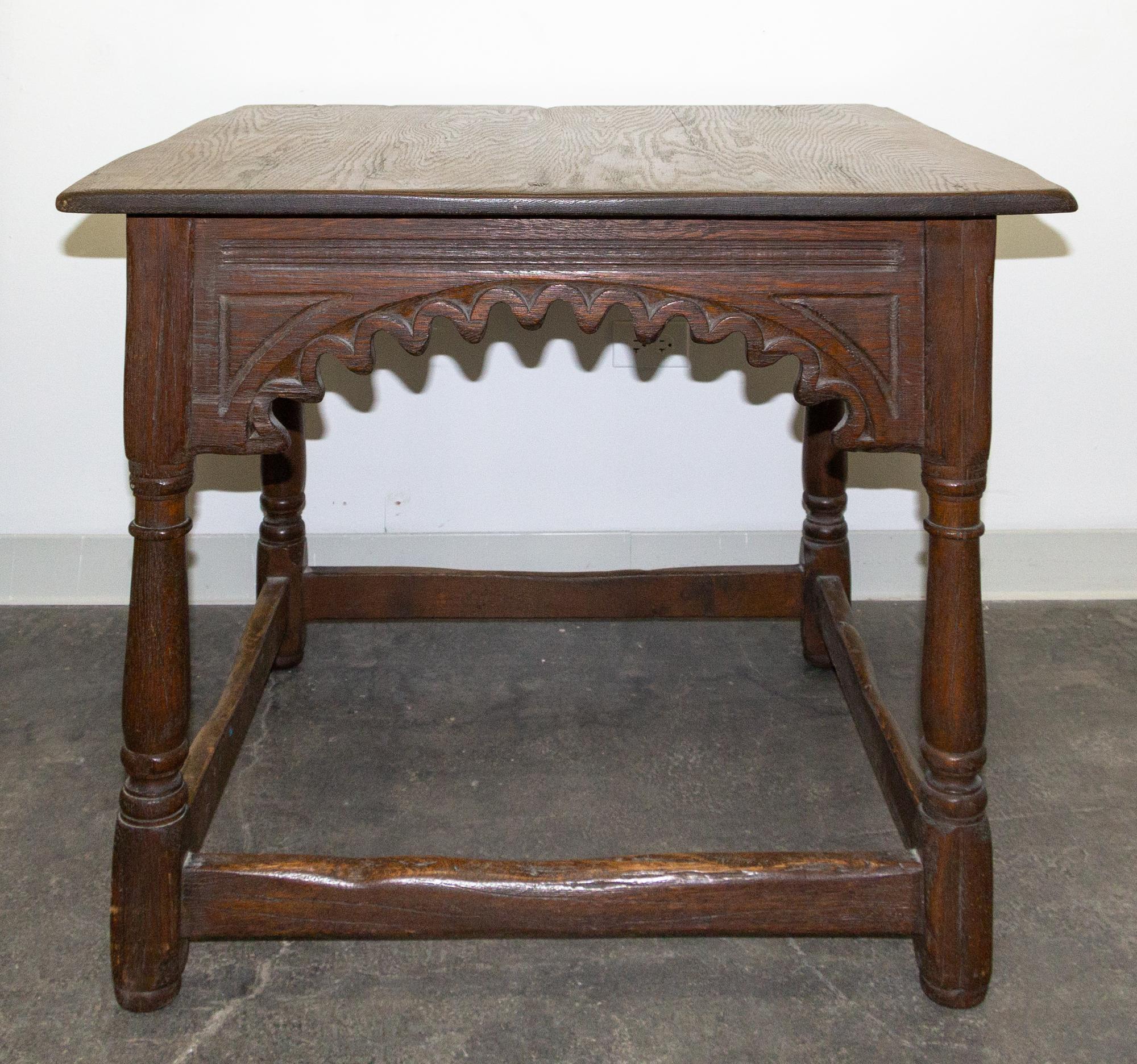 A Gothic Revival Oak Center Table Height 30 1/4 x width 36 x depth 36 inches. — EARLY 20TH CENTURY
