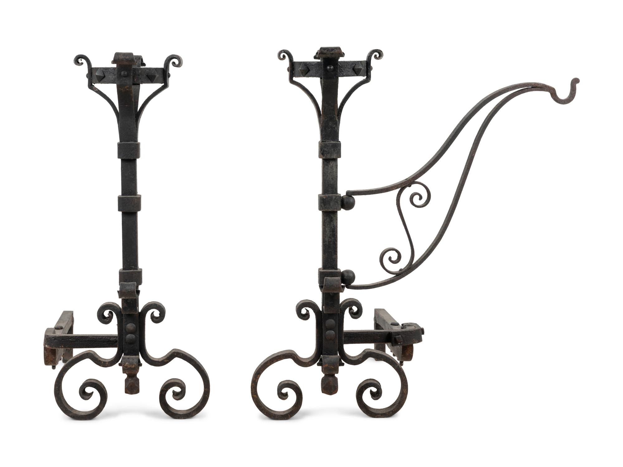 A Pair of Continental Iron Andirons with Posset Cup Holders