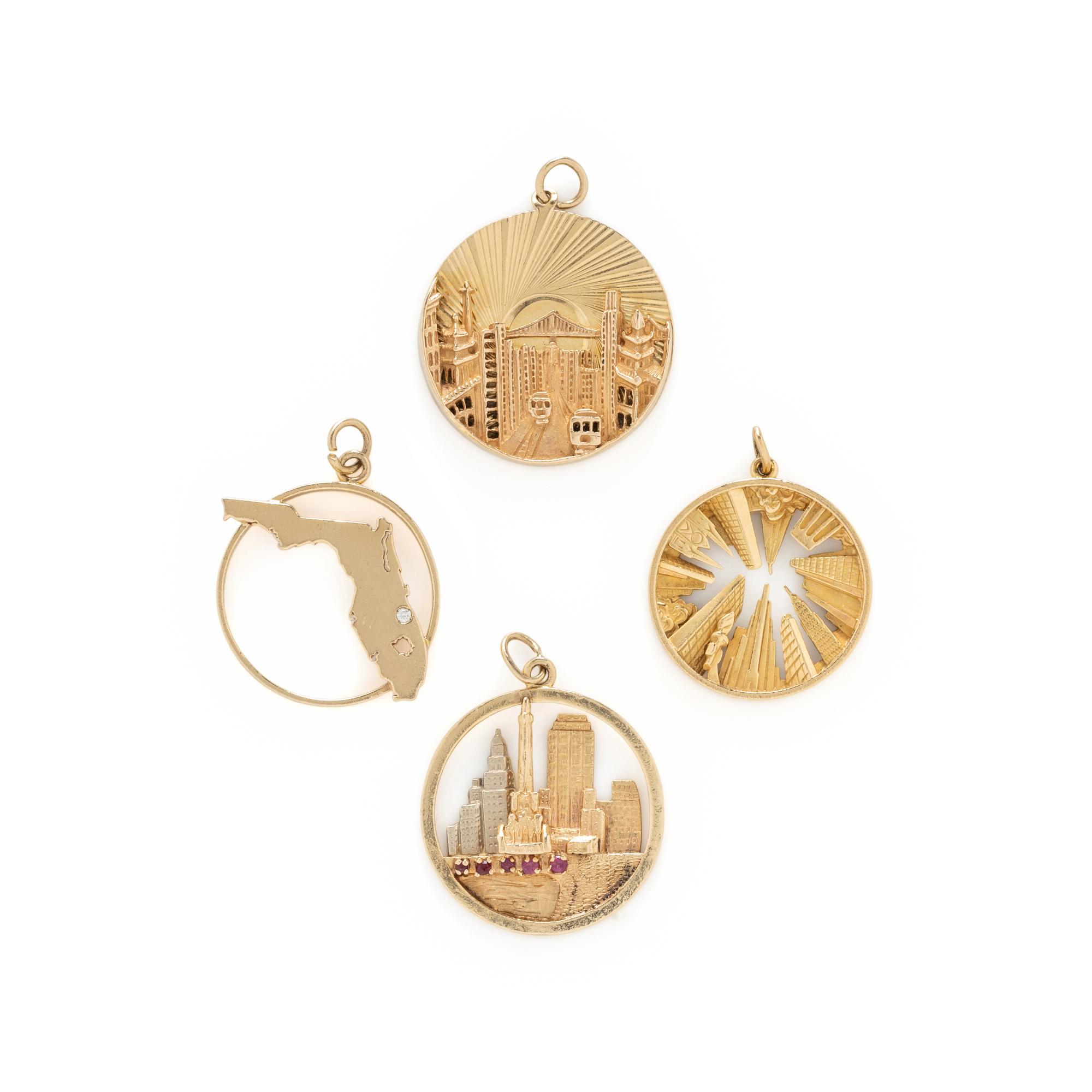 COLLECTION OF YELLOW GOLD CHARMS