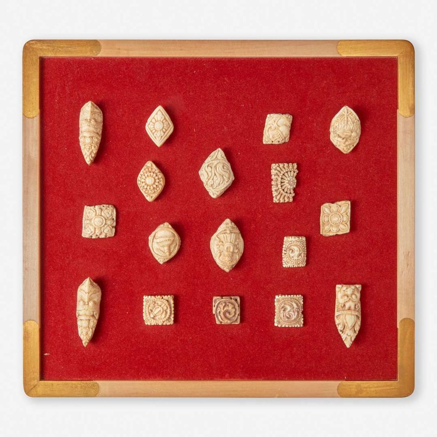 Two framed collections of Tibetan carved bone apron ornaments 藏传佛教法衣骨片两套