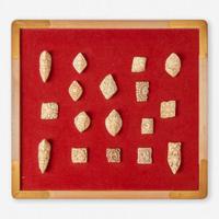 Two framed collections of Tibetan carved bone apron ornaments 藏传佛教法衣骨片两套
