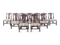 A Set of Fourteen George III Style Carved Mahogany Dining Chairs