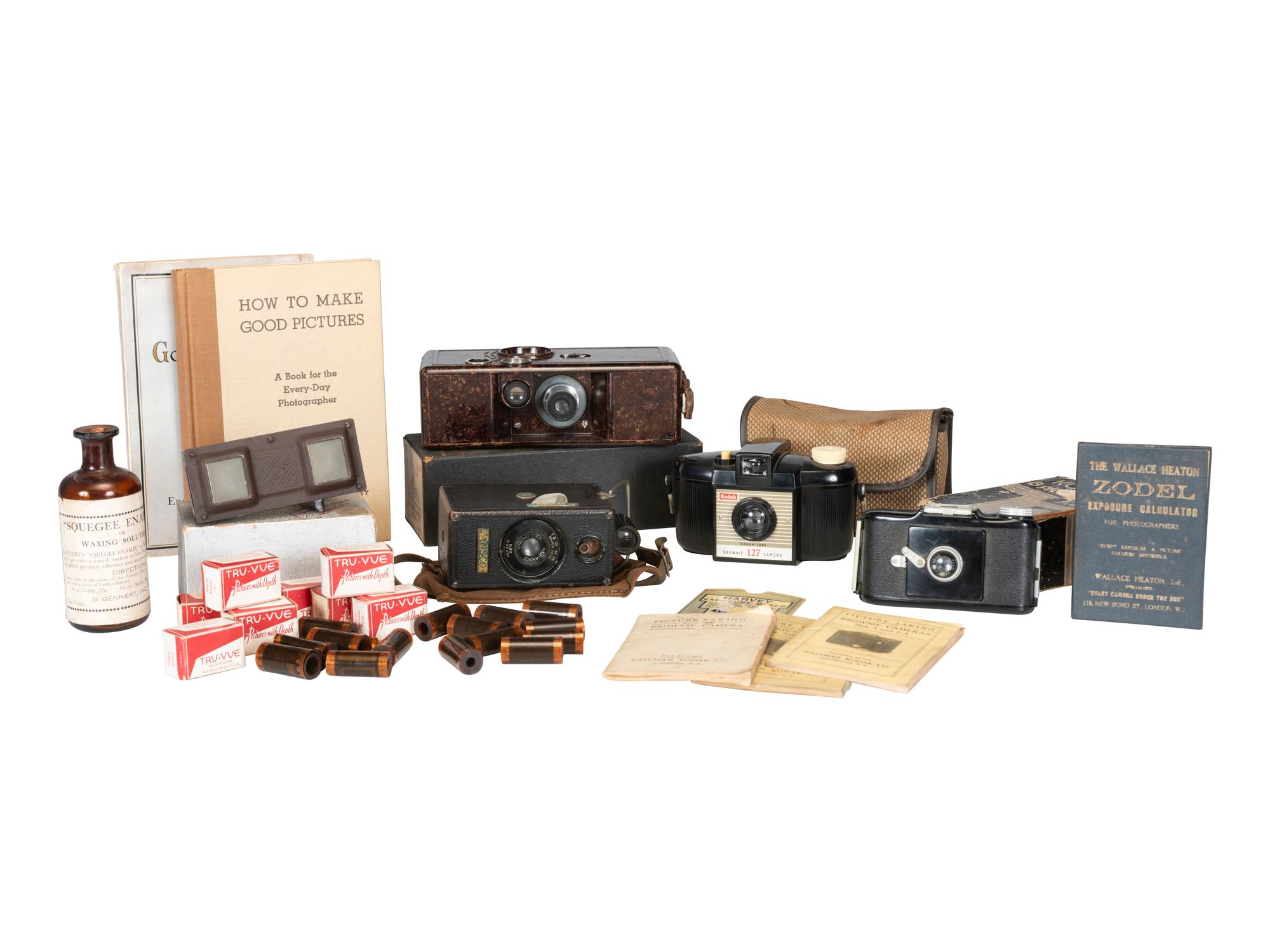 [EARLY PHOTOGRAPHY] 13 cameras incl. Kodak and Blair examples, with various manuals and guides.