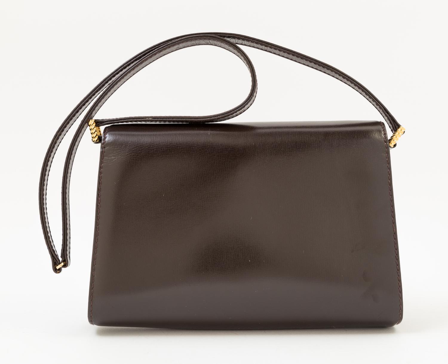 A Gucci Dark Brown Leather Flap Handbag, 8" x 6" x 2"; Strap drop: 14".