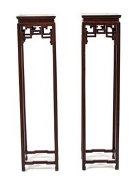 A Pair of Chinese Hardwood Stands Height 53 x width 13 x depth 13 inches. — 20TH CENTURY