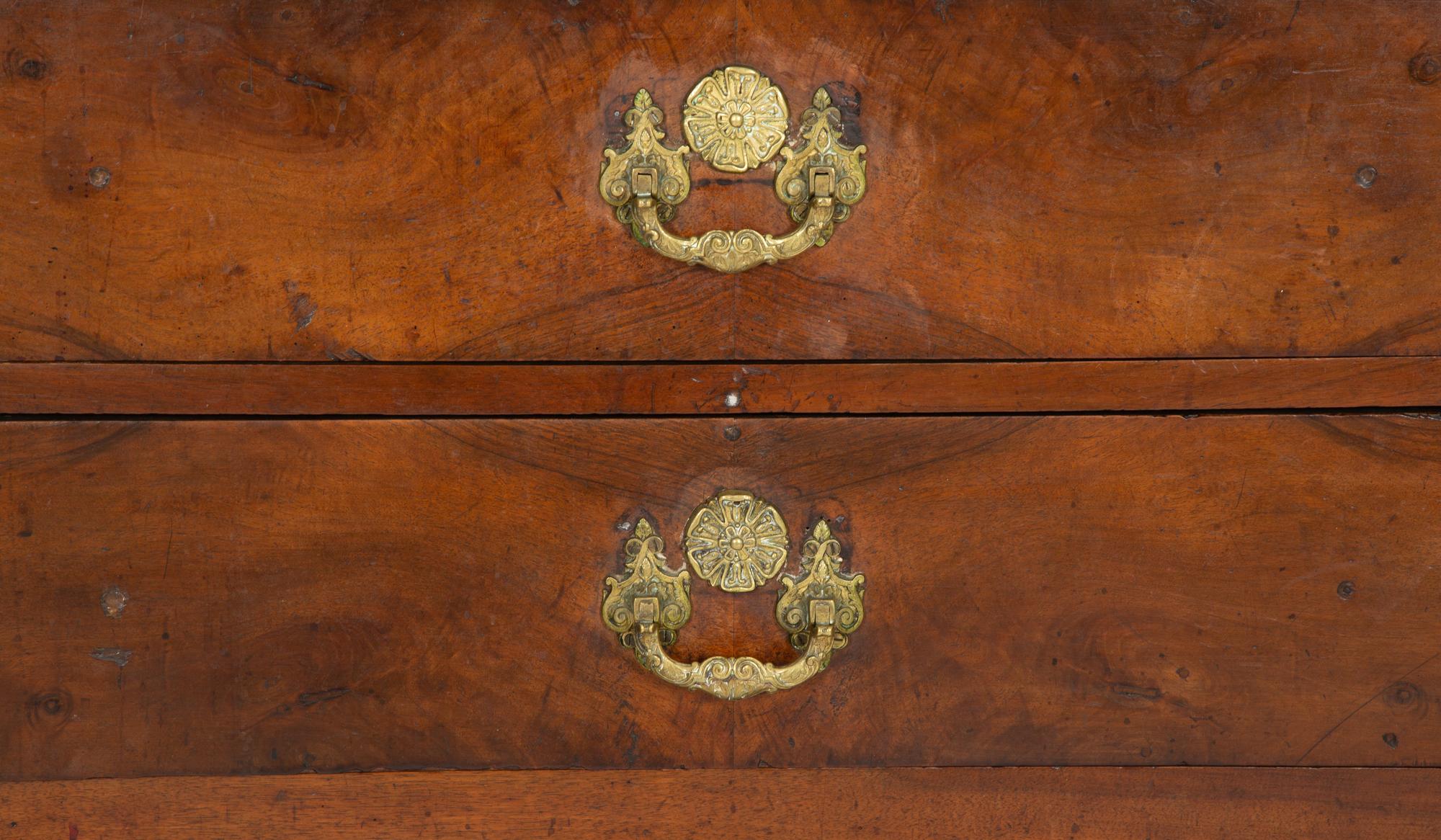 A Continental Walnut Two-Drawer Commode