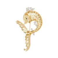 HAMMERMAN BROTHERS, BICOLOR GOLD, DIAMOND AND SAPPHIRE FISH BROOCH