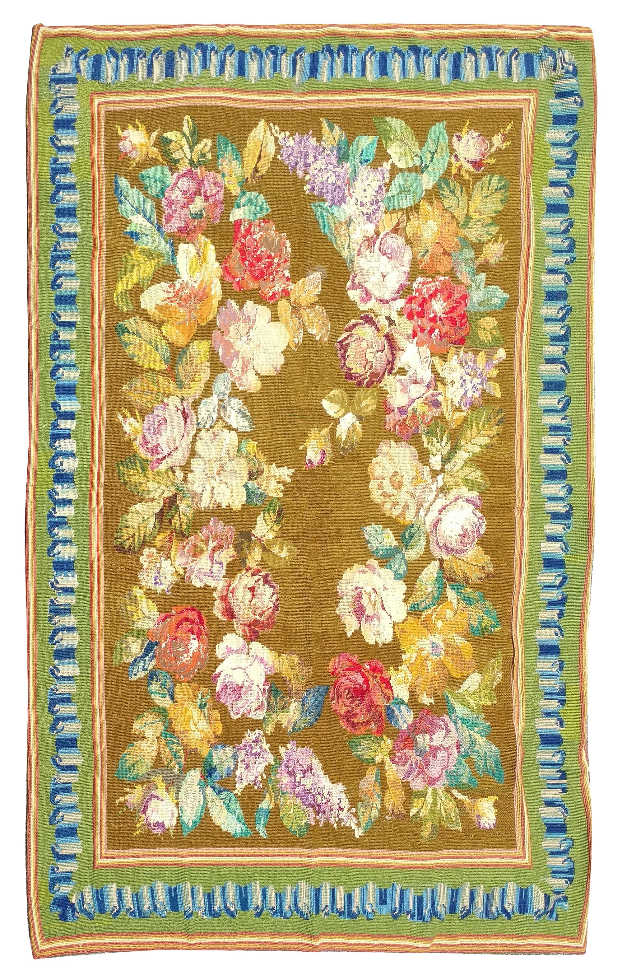 A Needlepoint Rug Length 8 feet 1 inch x width 5 feet 10 inches.