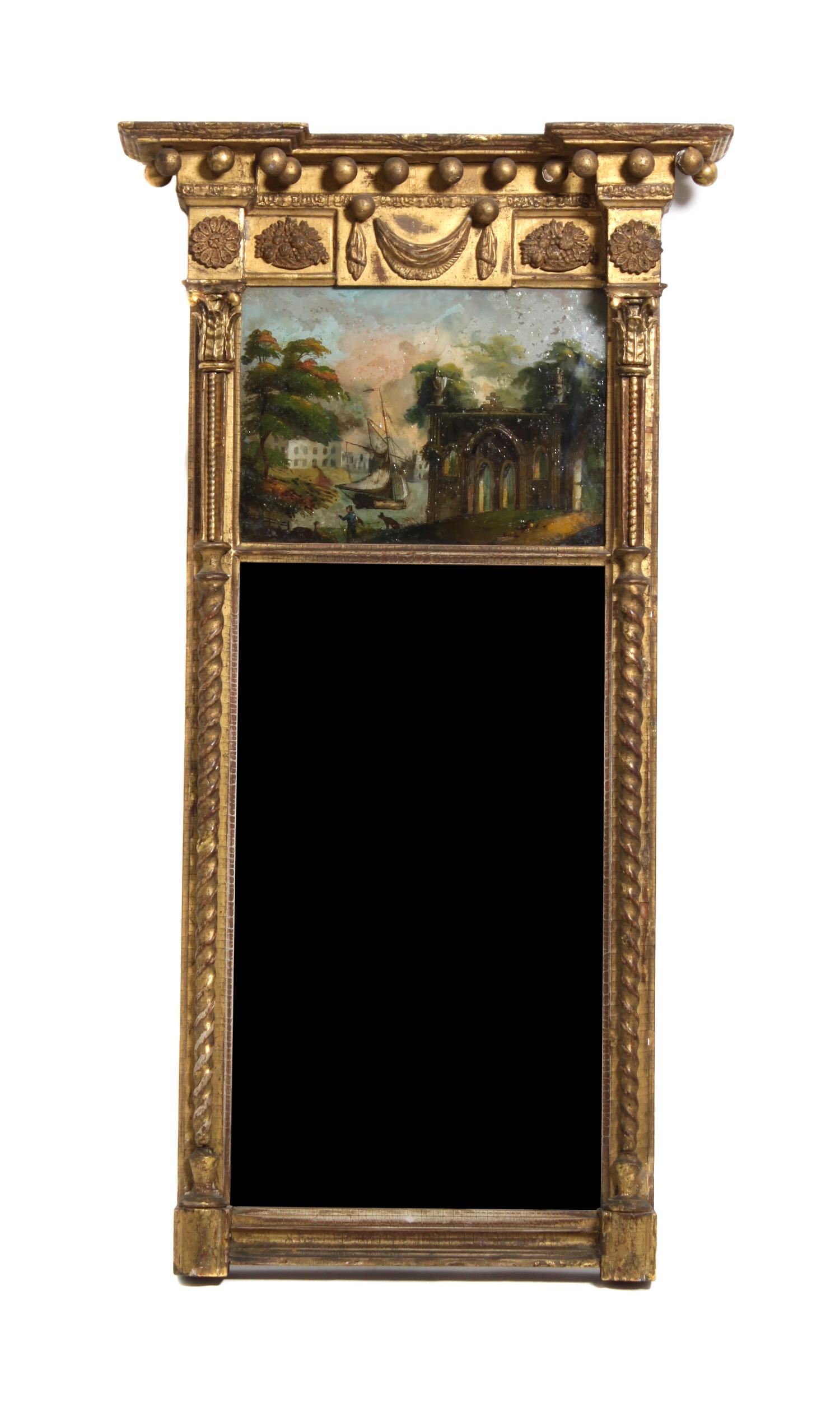A Regency Gilt and Reverse Painted Glass Mirror Height 44 x width 22 1/2 inches