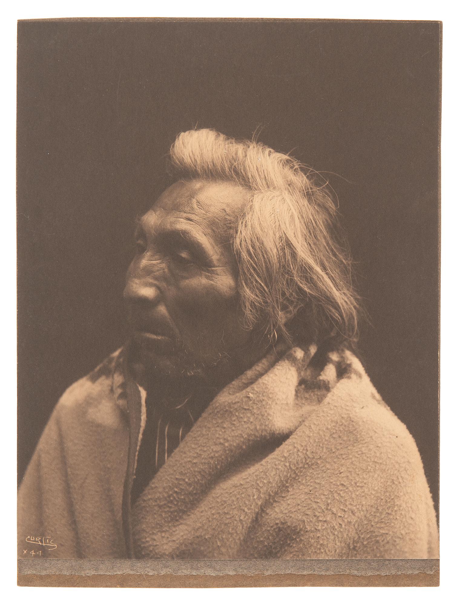 CURTIS, Edward S (1868-1952), photographer. 3 works, including two platinum photographs of a Native American subjects.