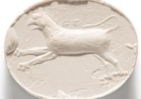 A Greco-Persian Blue Chalcedony Scaraboid with a Leaping Griffin