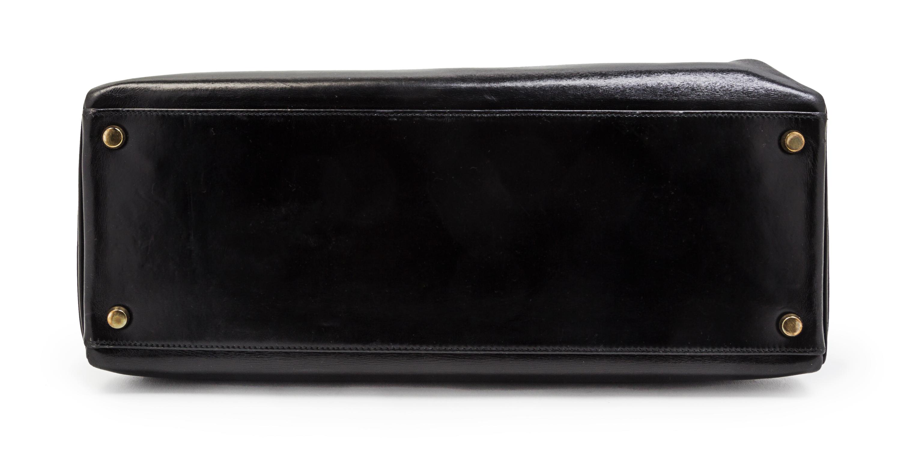 An Hermes 35cm Black Leather Kelly Bag, 14 x 8 x 7 inches.
