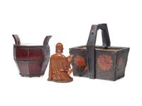 A Chinese Carved Boxwood Seated Immortal and Two Chinese Lacquered Wood Baskets