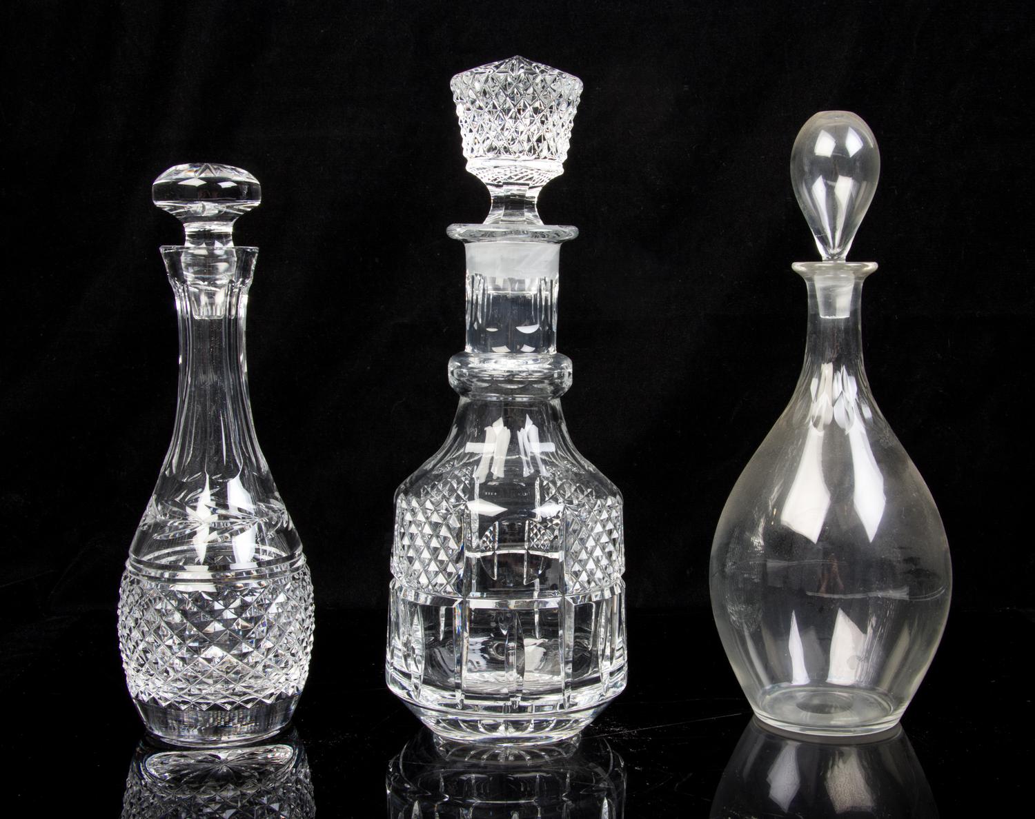 Five Molded or Cut Glass Decanters Height of tallest 13 inches.
