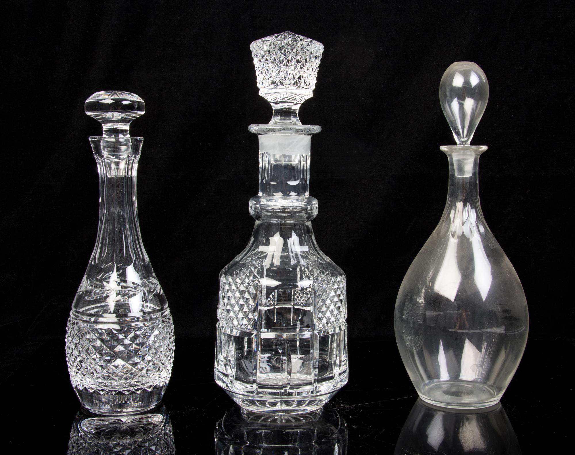 Five Molded or Cut Glass Decanters Height of tallest 13 inches.