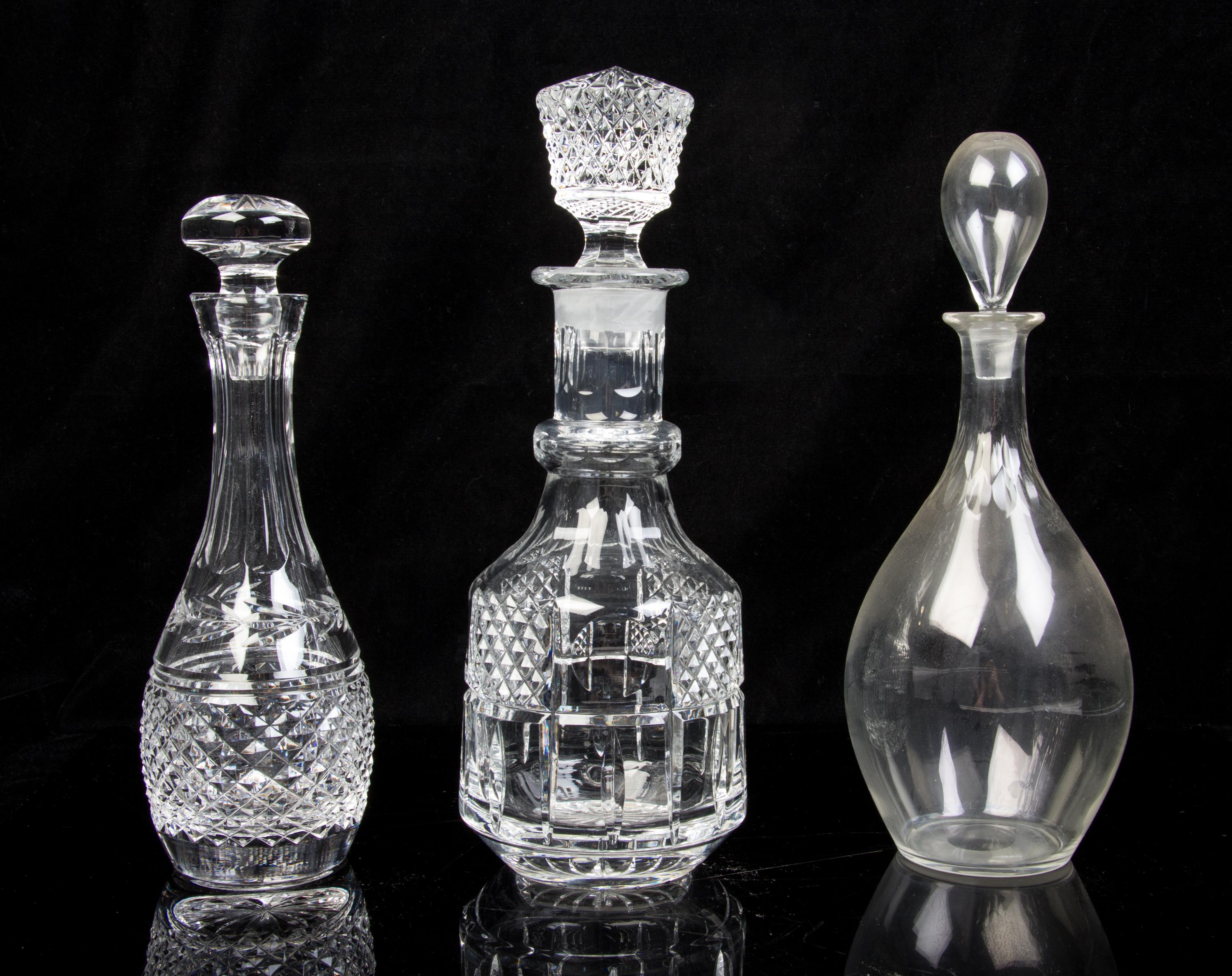 Five Molded or Cut Glass Decanters Height of tallest 13 inches.
