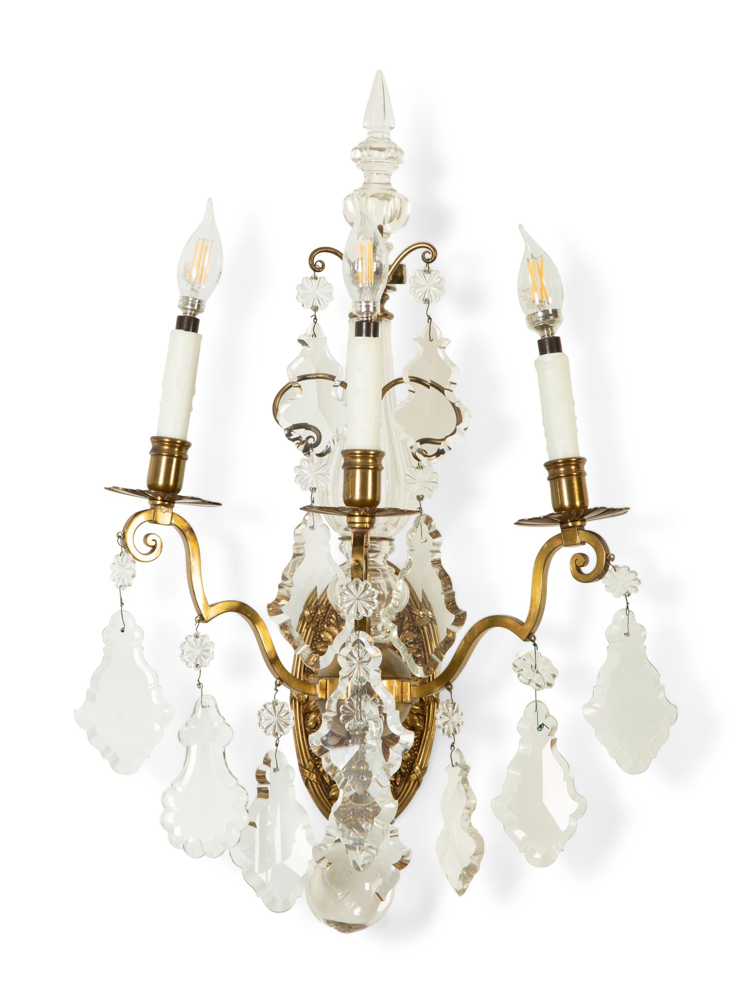 A Pair of Louis XV Style Gilt Bronze and Cut Glass Three-Light Sconces