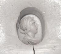 A Roman Hematite Ring Stone with a Male Portrait Head, Possibly the God Apollo