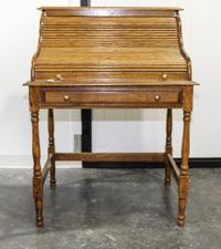 A Roll Top Desk. Height 44 1/2 x width 32 1/2 x depth 24 inches.
