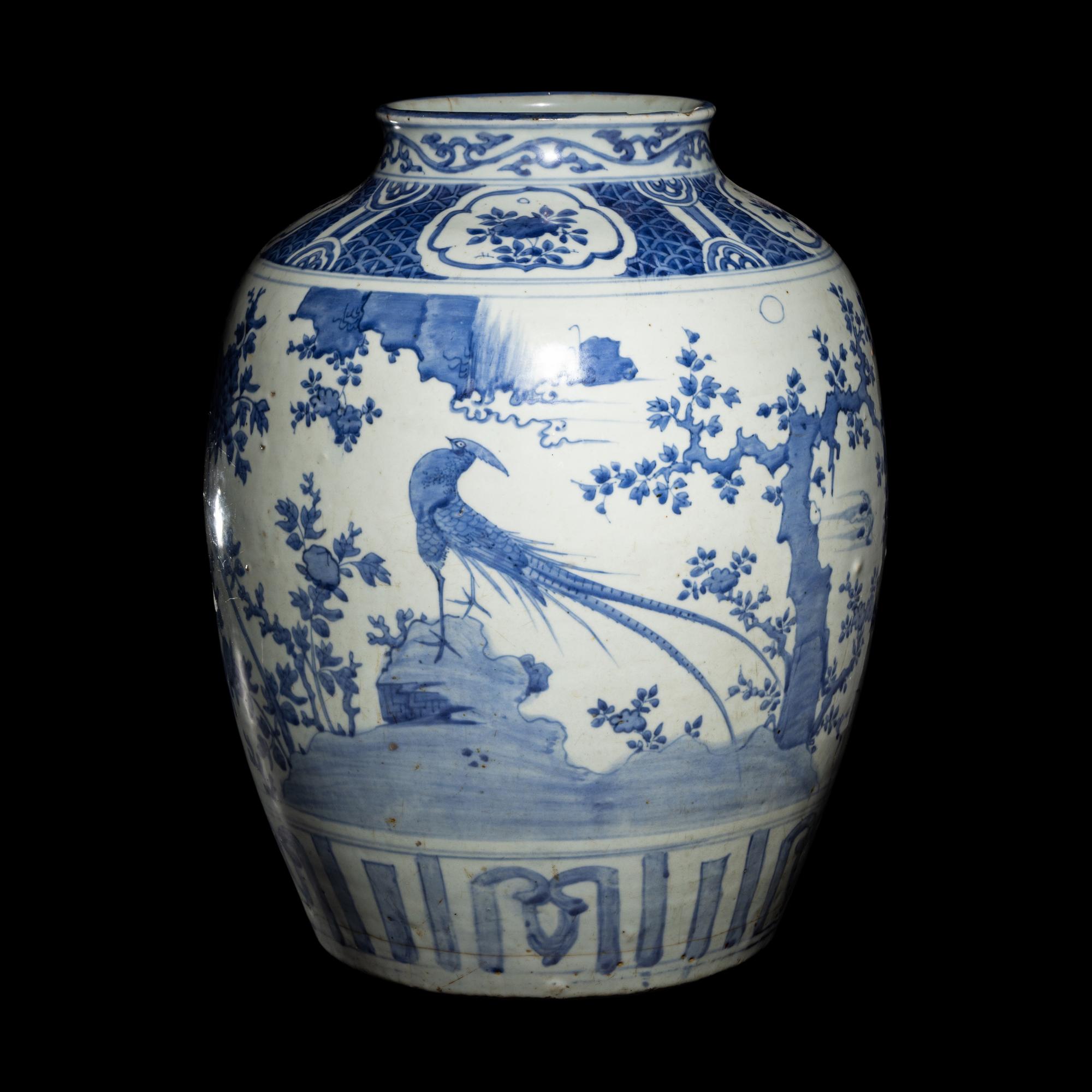 A Chinese Blue and White 'Birds and Trees' Porcelain Jar, 16th/17th Century 明末清初 青花花鳥圖大罐