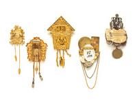 A GROUP OF FIVE TIMEPIECE THEMED BROOCHES