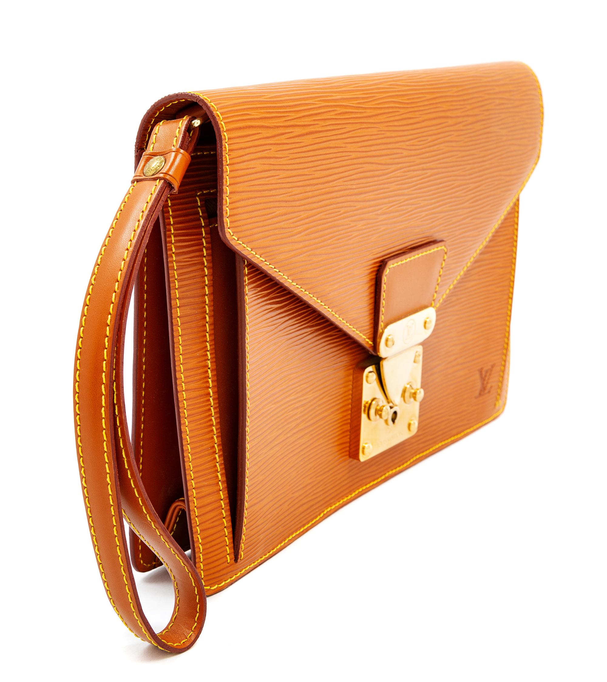 A Louis Vuitton Tan Epi Leather Sellier Dragonne Clutch, 6" H x 10.25" W x 1" D; Wristlet: 6" L.