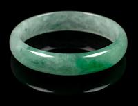 An Apple Green and Pale Celadon Jadeite Bangle