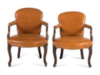 A Near Pair of George III Mahogany Leather-Upholstered Armchairs