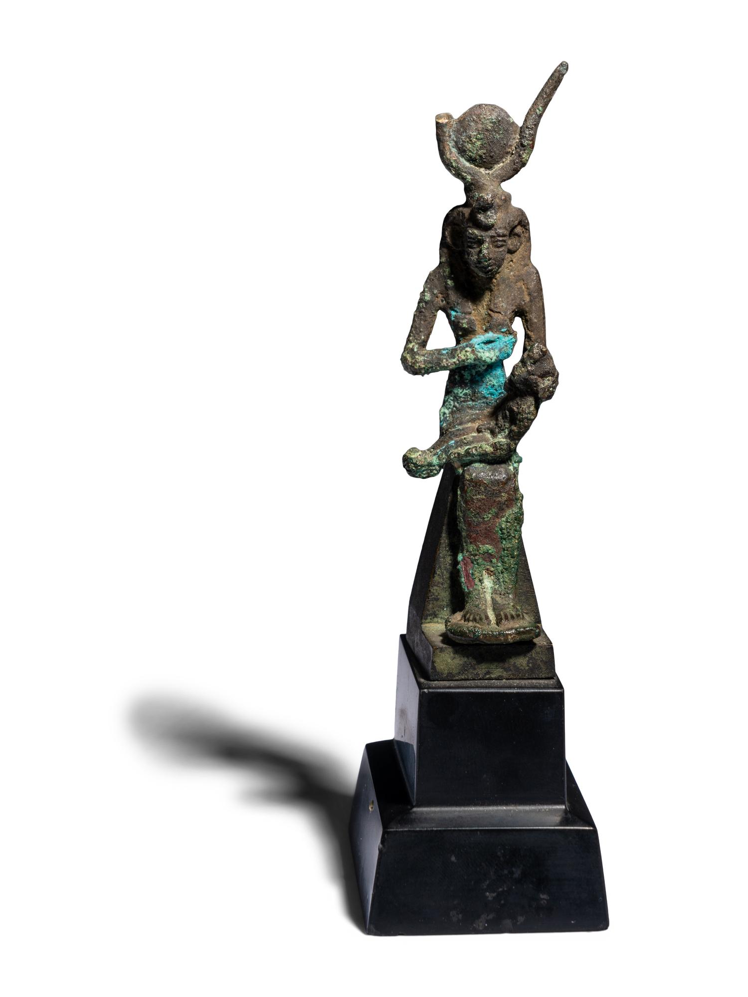 An Egyptian Bronze Isis Nursing Harpocrates