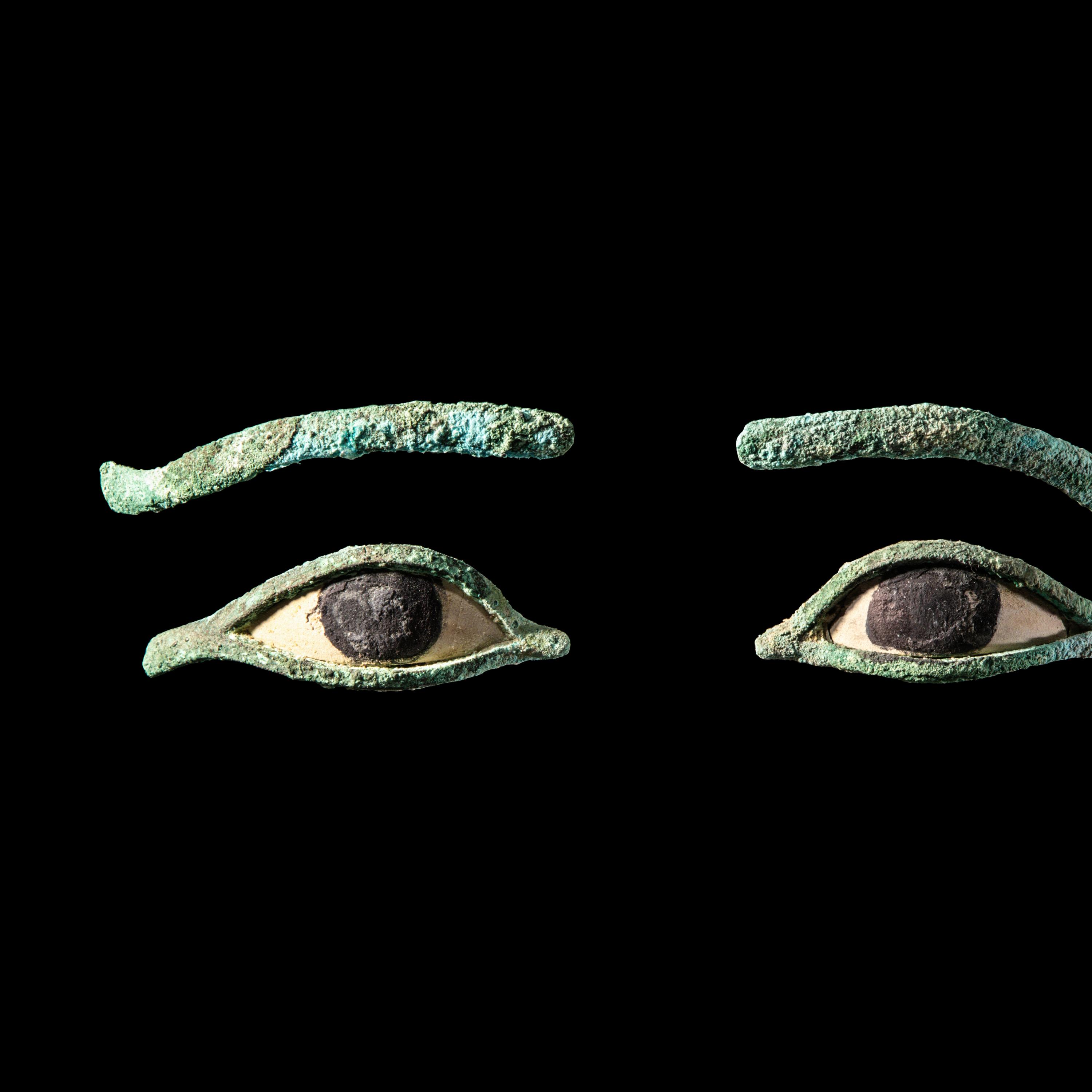 A Pair of Egyptian Bronze Eye Inlays