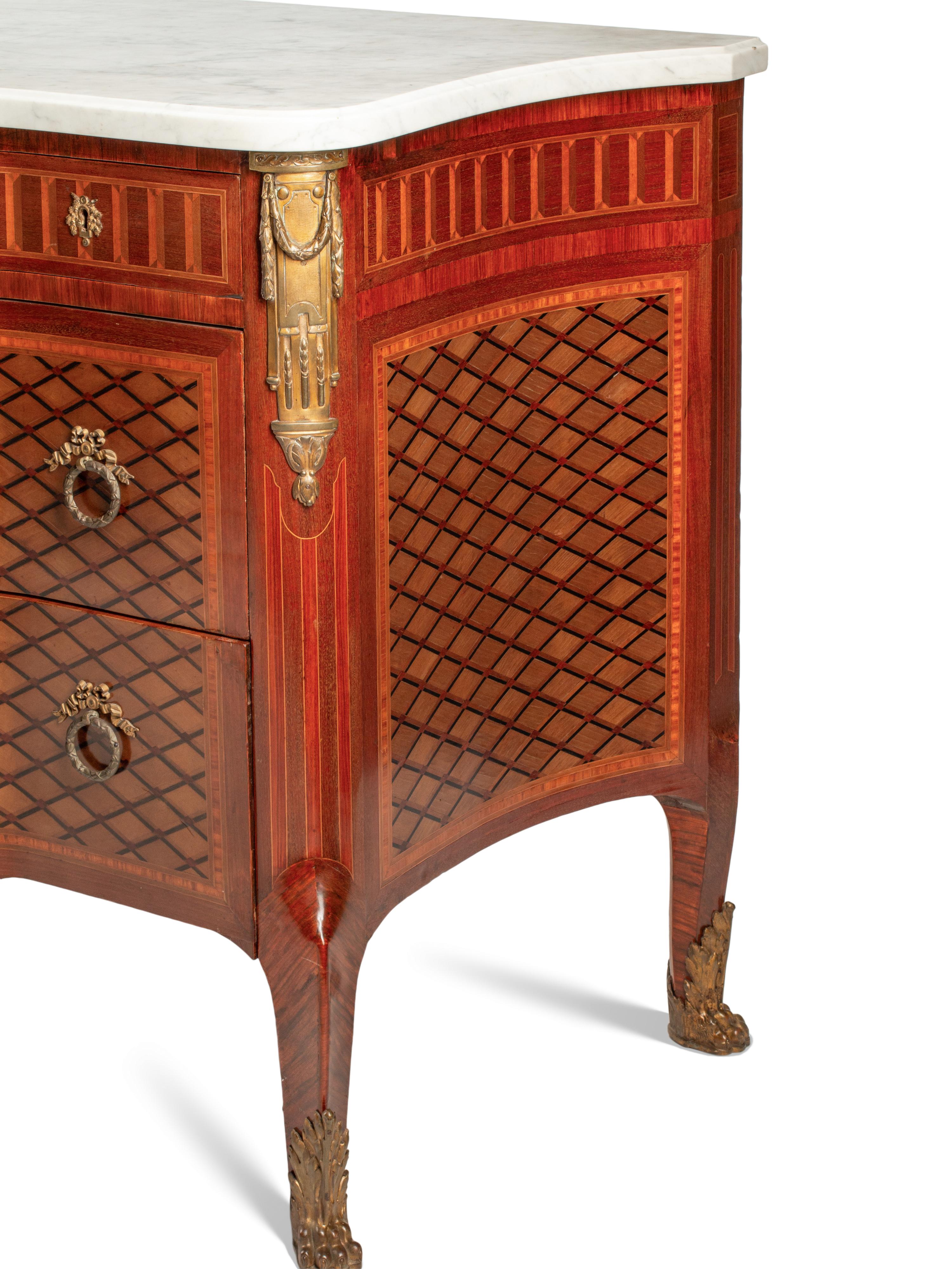 A Louis XVI Style Gilt Bronze Mounted Parquetry and Floral Marquetry Marble-Top Commode