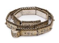 A Russian Niello Silver Belt, Tbilisi, Early 20th Century, having a beaded and filigree decorated top, the bands worked with niello fol
