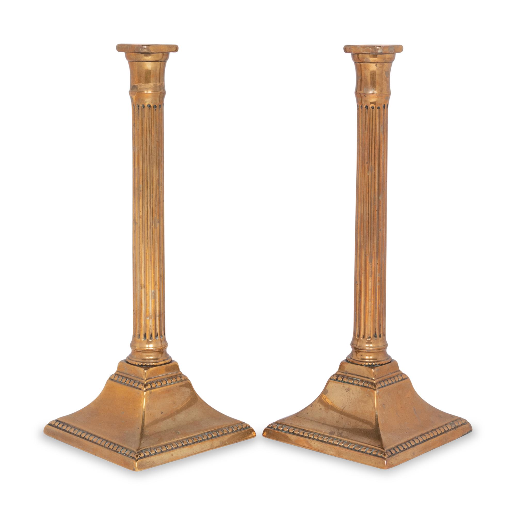 A Pair of George III Bronze Candlesticks