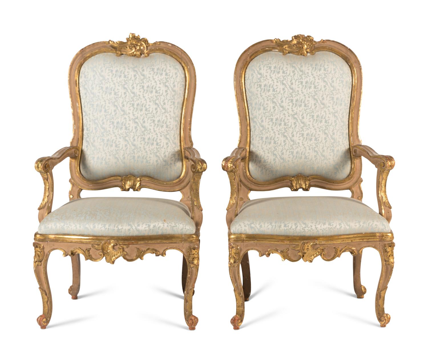 A Pair of Italian Rococo Painted and Parcel Gilt Armchairs
