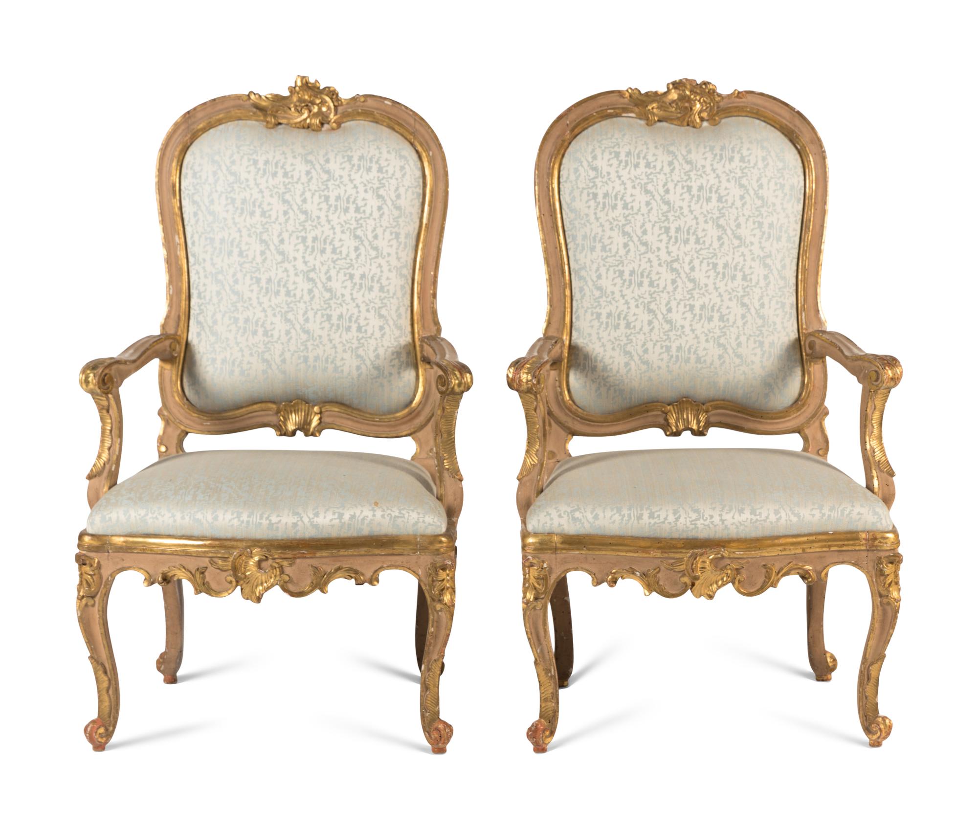 A Pair of Italian Rococo Painted and Parcel Gilt Armchairs