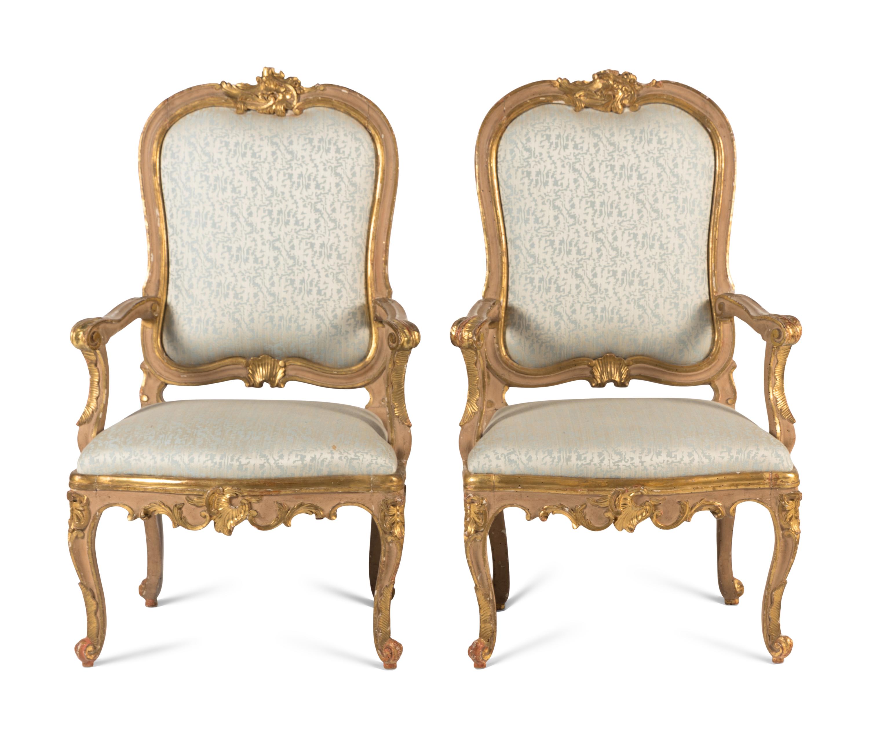 A Pair of Italian Rococo Painted and Parcel Gilt Armchairs