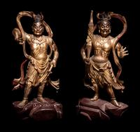 A Pair of Gilt and Red Lacquered Wood Figures of Guardians